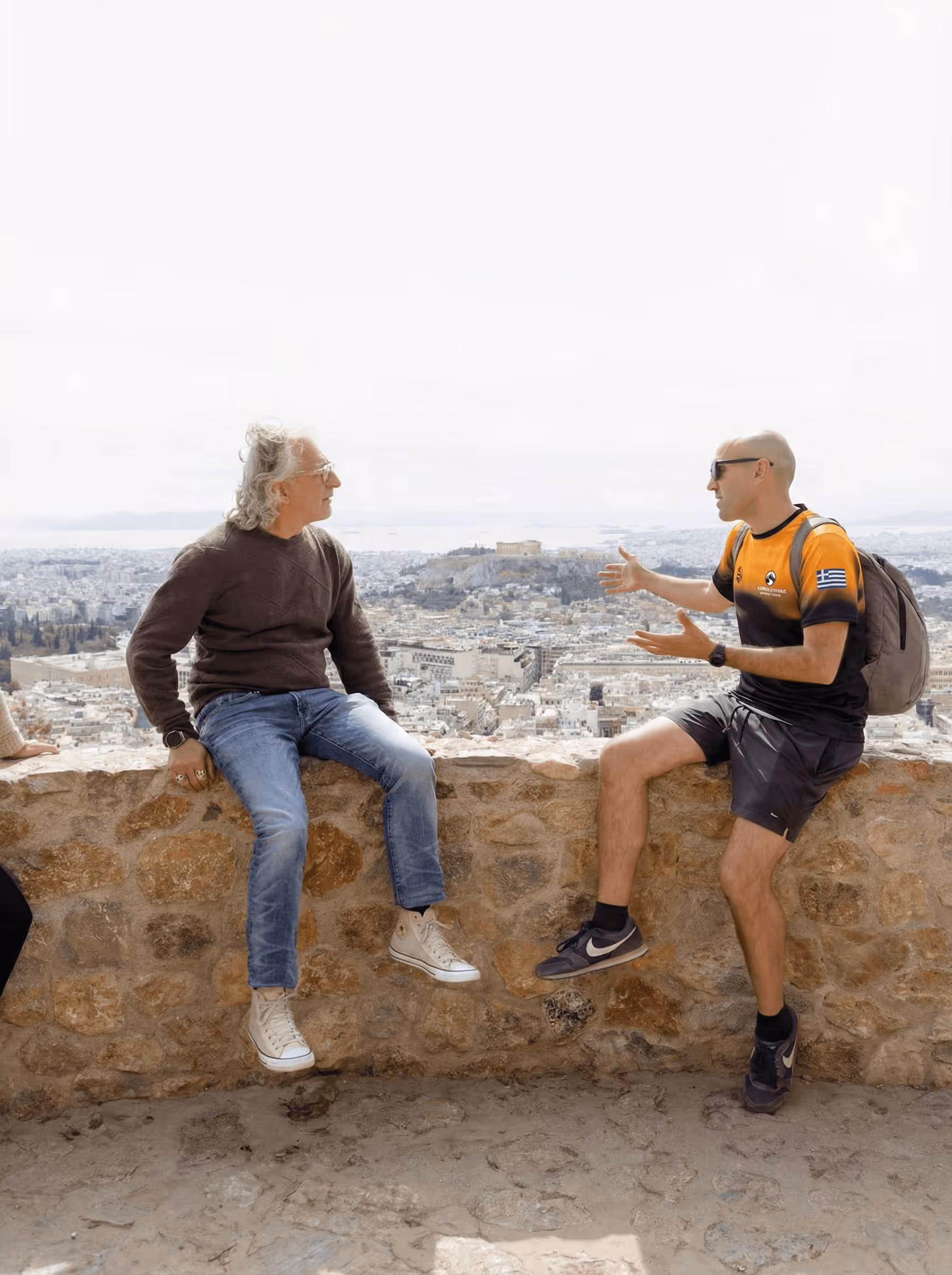 Small group watching sunrise from Lycabettus Hill summit on a guided Athens walking tour