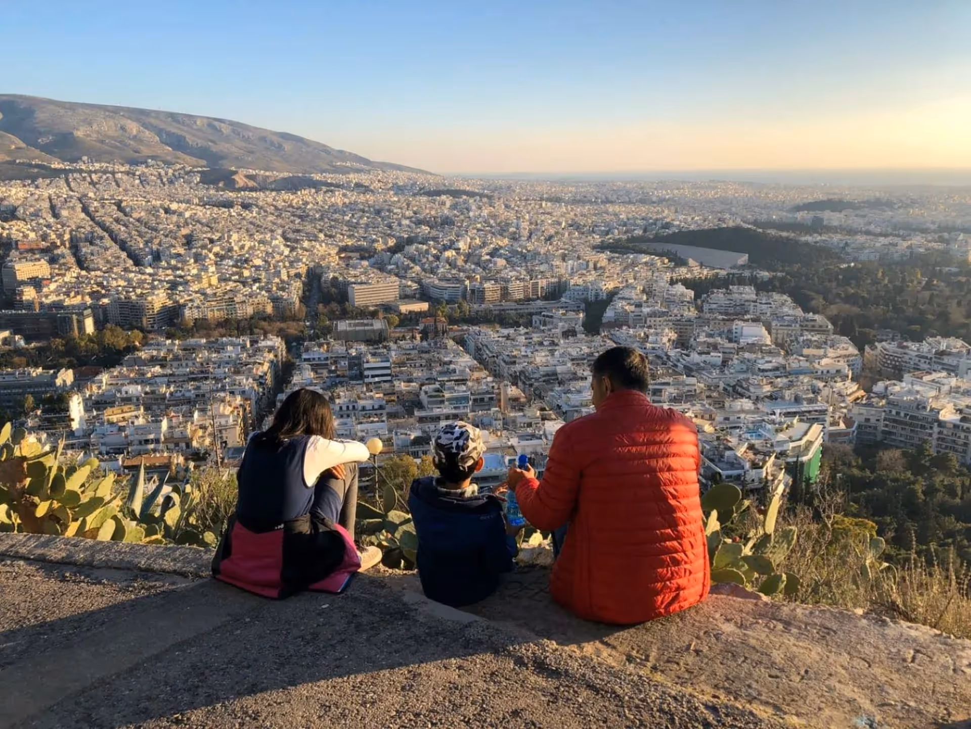 Athens skyline at first light from a quiet hillside lookout above the city